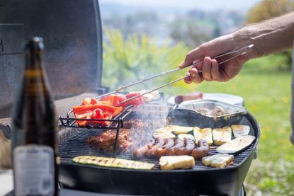 A gas grill being used safely 