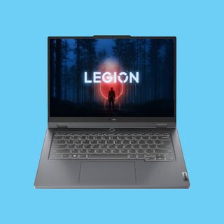 A Lenovo Legion 5 Slim 14 against a pastel blue background