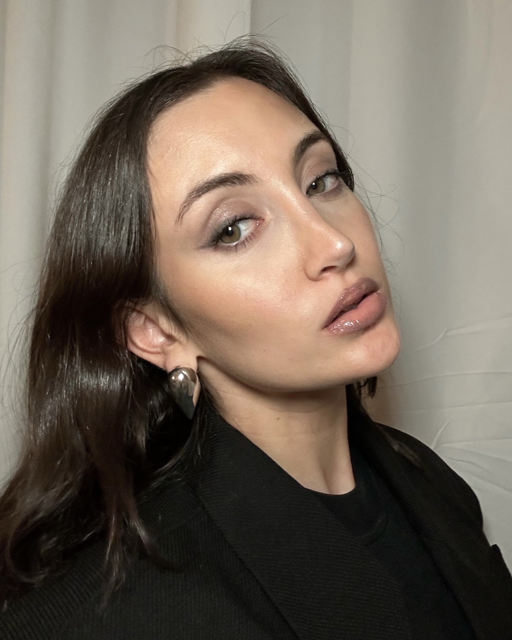 Alyssa Brascia wearing the Armani Beauty Prisma Glass Hydrating Lip Gloss in Nude Glow.