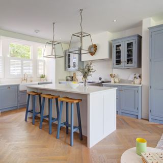 kitchen area with blue cabinets and worktop