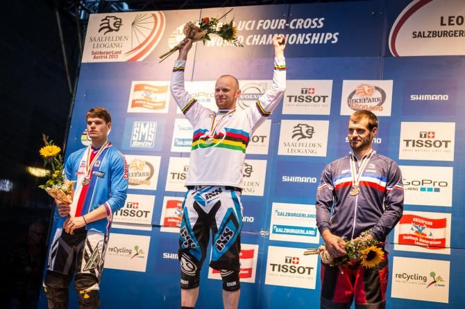 Joost Wichman stands atop the elite men's four cross world championship podium