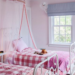 children bedroom with sugary pink wall and fairy tale theme