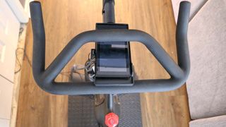 A picture of a Nintendo Switch resting on a phone holder for the Peloton Bike Plus