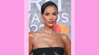 Maya Jama attends The BRIT Awards 2023 at The O2 Arena on February 11, 2023 in London, England./ in a purple/pink template