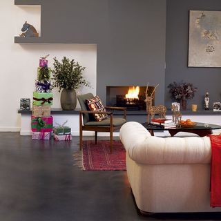 grey living room with fire place and dark flooring