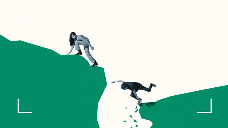 Young woman looking back at male friend falling from green cliff against white background