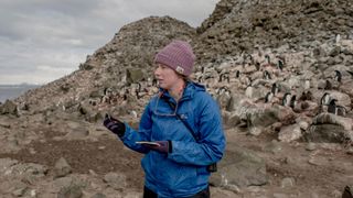 Clare Flynn, a doctoral candidate in the Department of Ecology and Evolution at Stony Brook University, conducts research at a penguin colony in Wide Open Island in Antarctica.