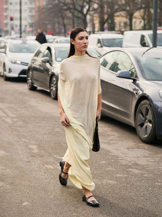 woman wearing draped dress