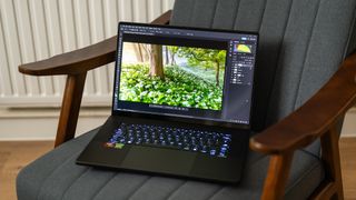 Asus ProArt P16 laptop on a chair