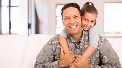service member with child