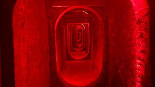 Tunnels in the prison lit red