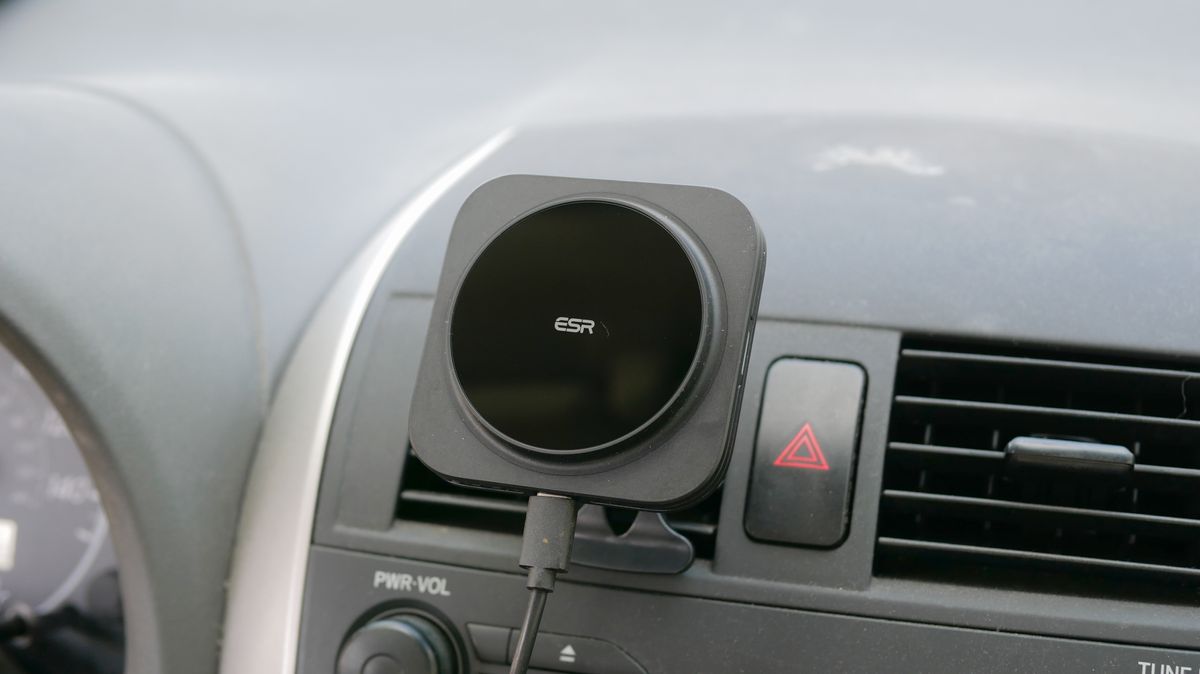 ESR HaloLock MagSafe Car Charger attached to vent clip in car with iPhone.