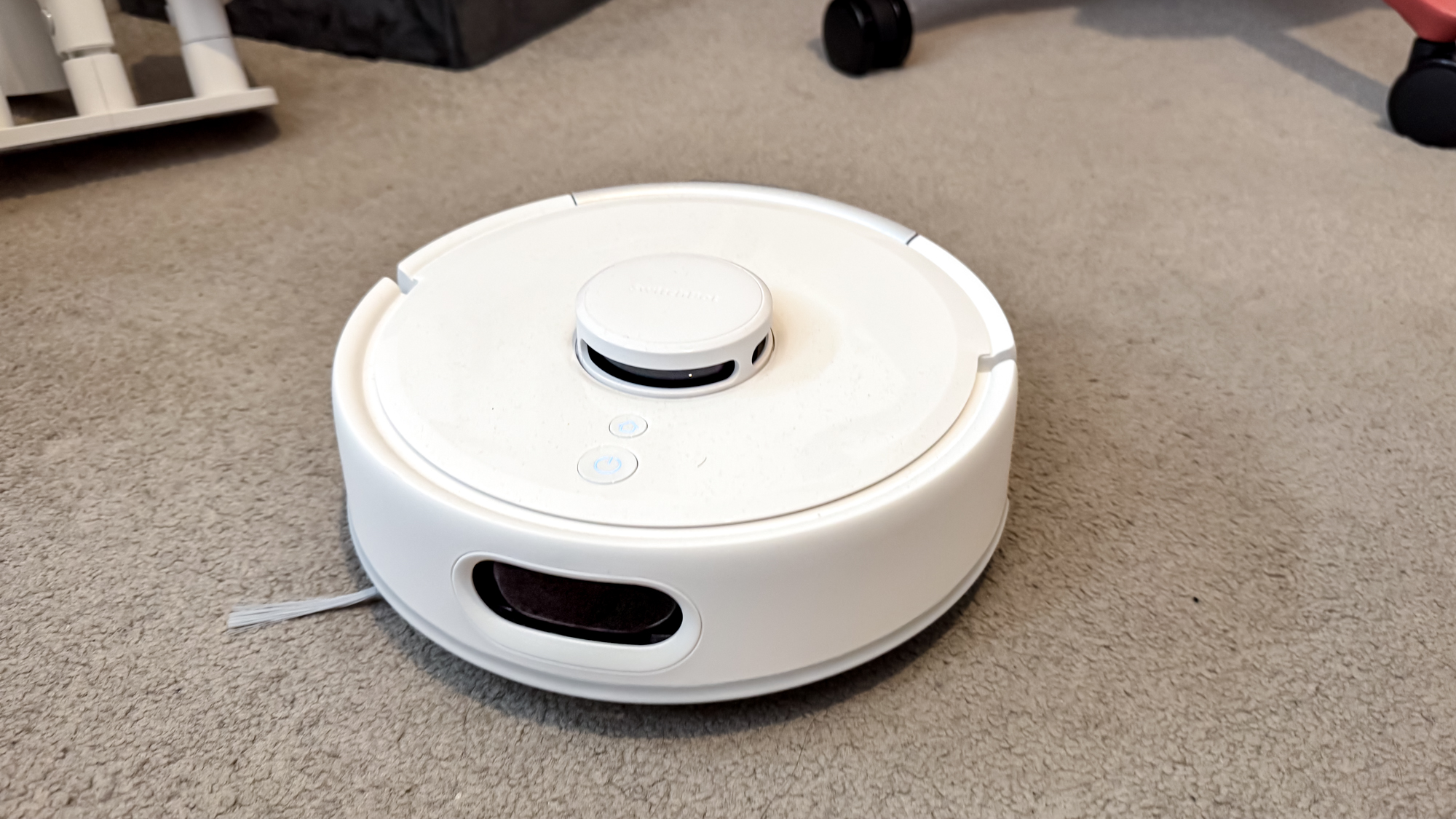 SwitchBot K10+ Pro robot vacuum on carpet
