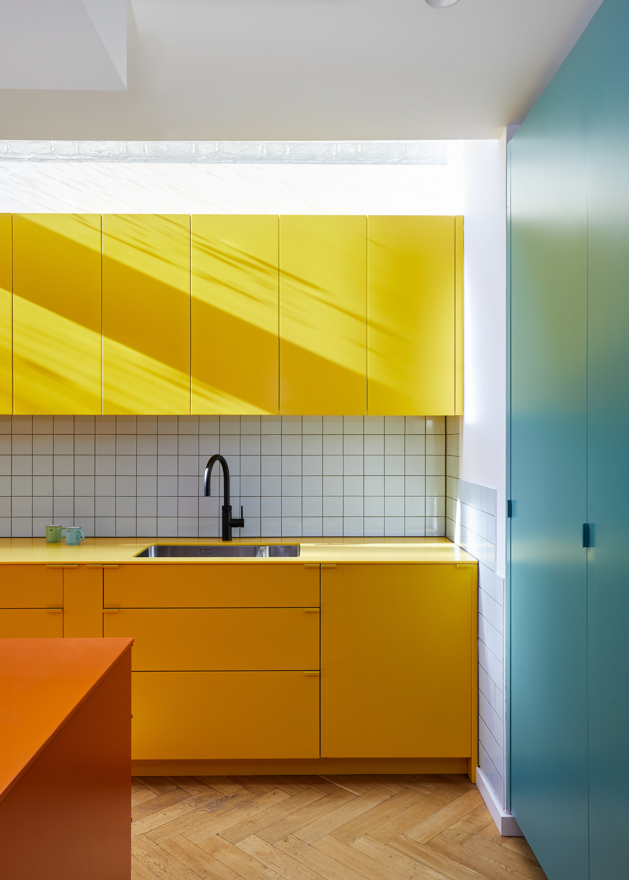 yellow himac kitchen cabinets in a sleek, modern design