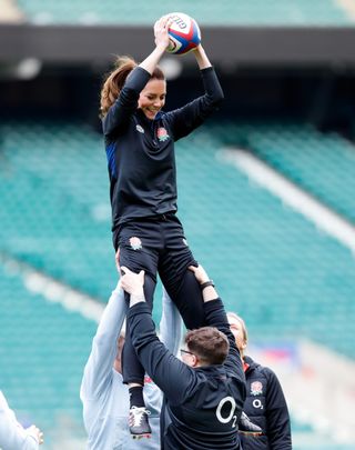 LONDON, UNITED KINGDOM - FEBRUARY 02: (EMBARGOED FOR PUBLICATION IN UK NEWSPAPERS UNTIL 24 HOURS AFTER CREATE DATE AND TIME) Catherine, Duchess of Cambridge takes part in a lineout drill during an England rugby training session, after becoming Patron of the Rugby Football Union at Twickenham Stadium on February 2, 2022 in London, England. (Photo by Max Mumby/Indigo/Getty Images)