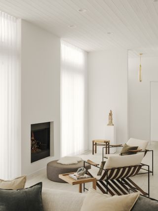 Minimalist neutral living room with light drapes