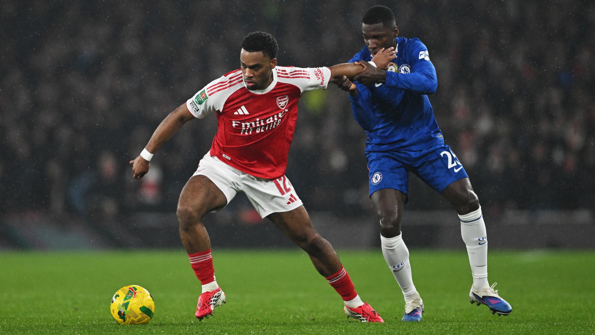 Jurrien Timber of Arsenal controls the ball whilst under pressure from Moises Caicedo of Chelsea