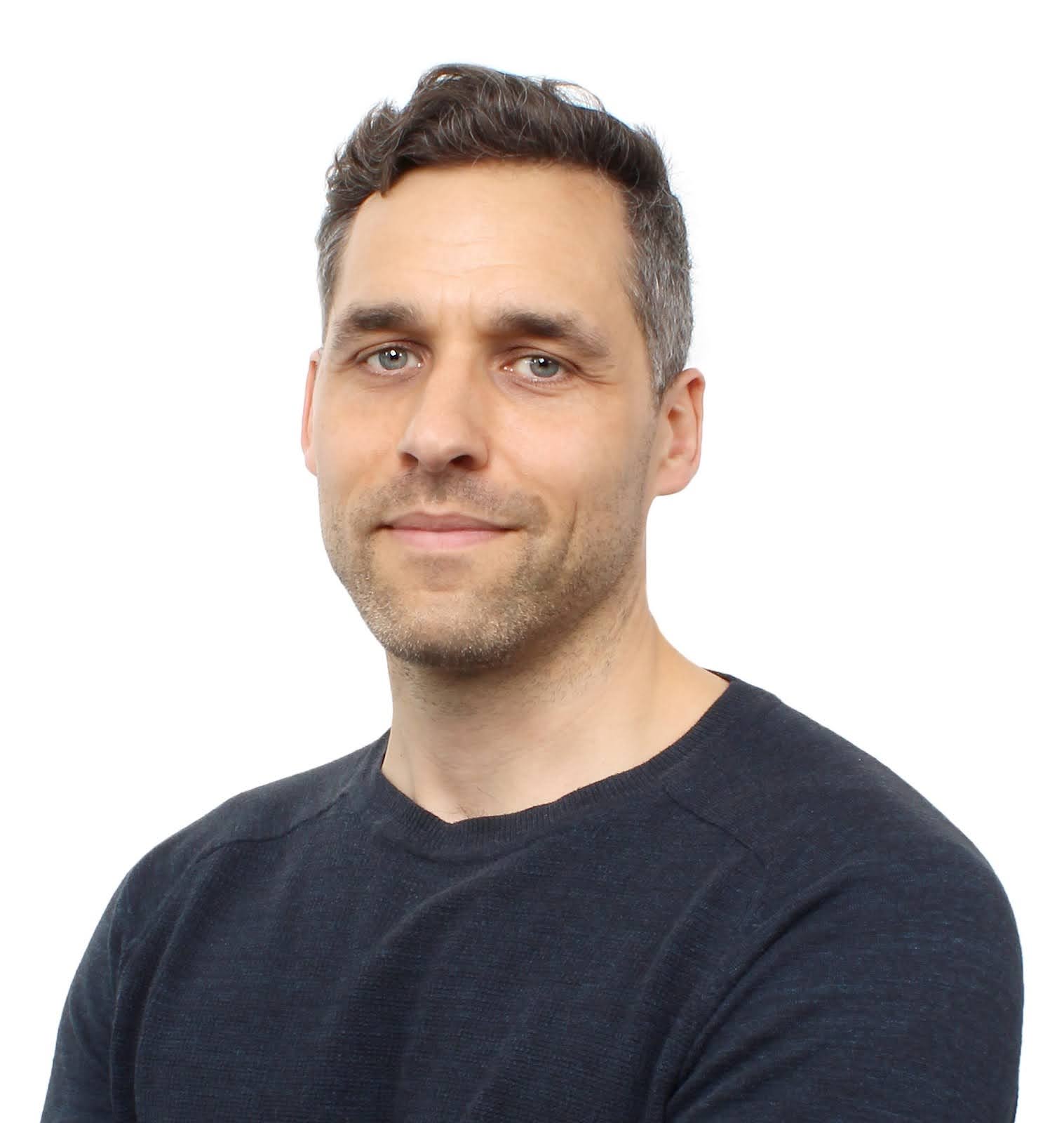Head and shoulders shot of man looking at camera