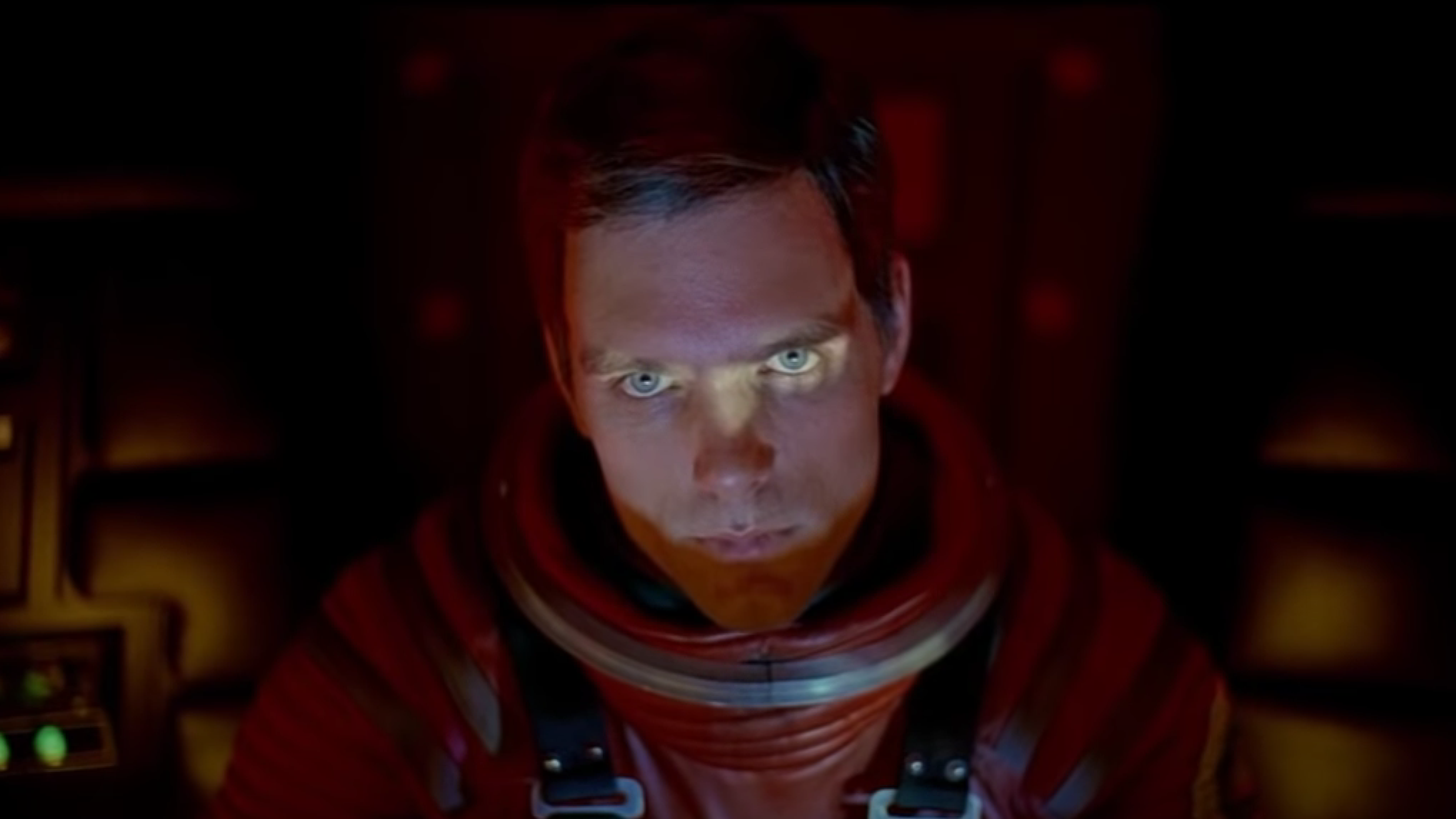 Still from the movie 2001: A Space Odyssey showing the character Dave Bowman asking the AI HAL 9000 to 'open the pod bay doors'.