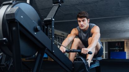 Man performing a workout on the rowing machine