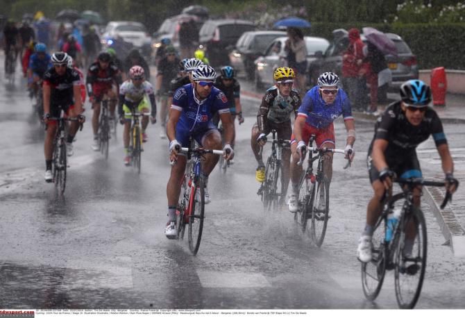 Riders thinking of a nice warm shower after the wet stage