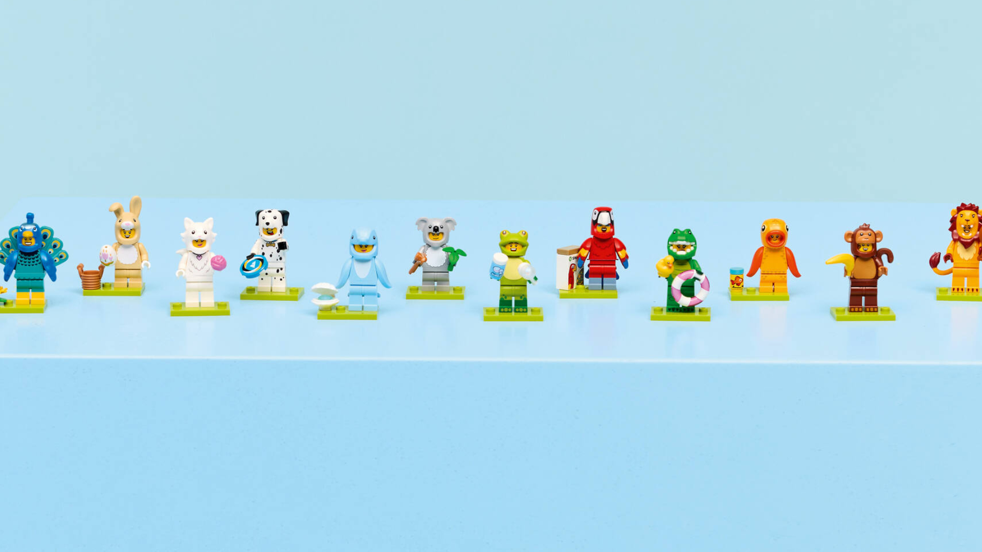 Lego Minifigures Animal Series 28 lined up on a blue surface