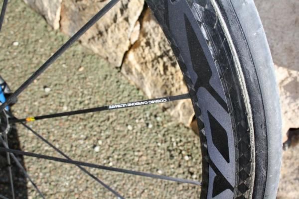 Mavic's latest Cosmis Carbone Ultimate rims use reflective decals.