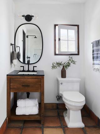 a small bathroom with a modern rustic look