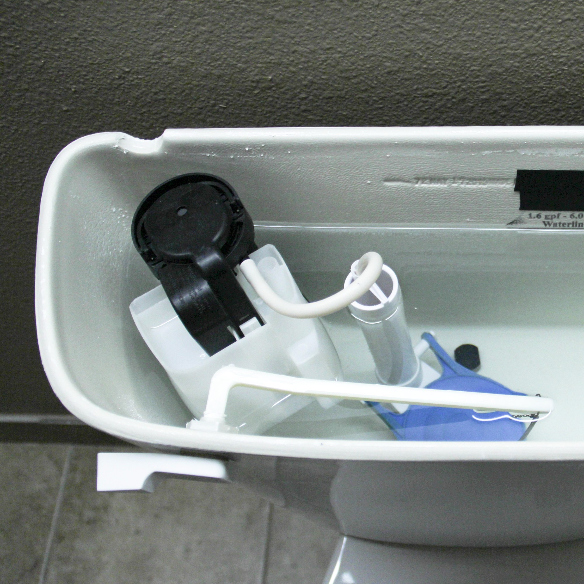 Inside the cistern of a toilet