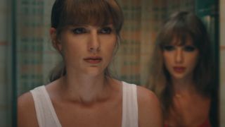 Taylor Swift looking at herself in the mirror with another version of herself standing behind her.