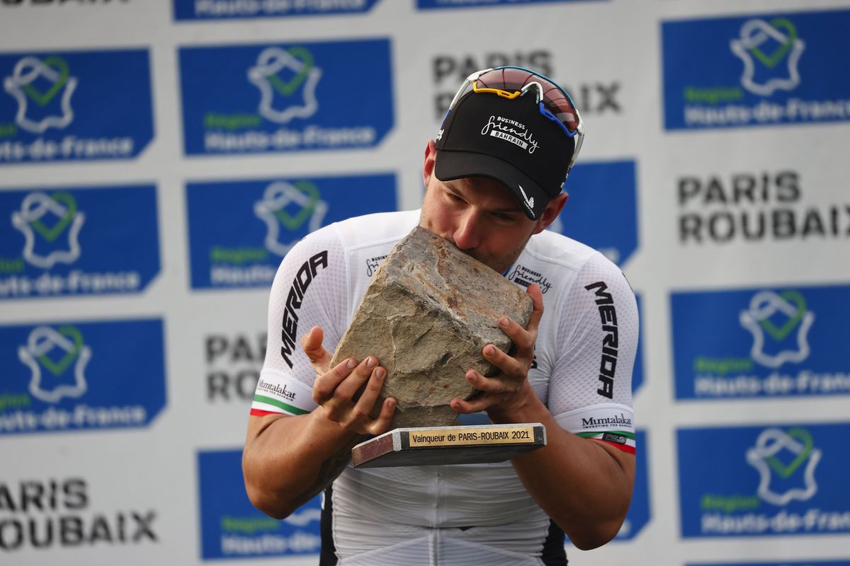 Sonny Colbrelli (Bahrain Victorious) celebrates his victory on the podium of the 2021 Paris-Roubaix