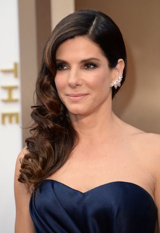 Sandra Bullock arrives on the red carpet for the 86th Academy Awards on March 2nd, 2014 in Hollywood, California