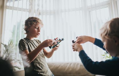 Free Lego event at The Entertainer this Saturday - two boys play with Lego vehicles