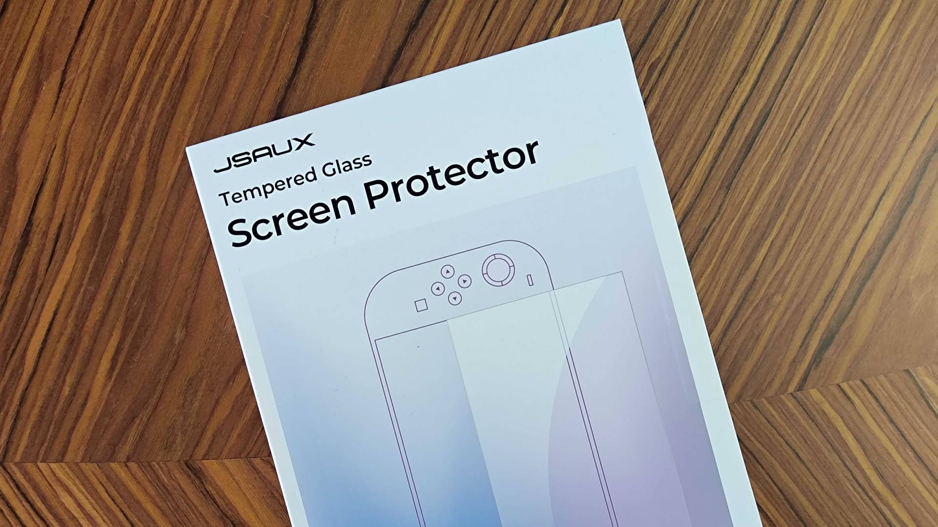 Jsaux Switch 2 screen protector box on woodgrain table.