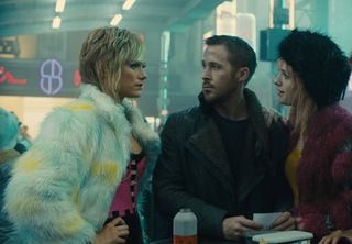 Krista Kosenen as Doxie #2, Ryan Gosling as K and Mackenzie Davis as Mariette in "Blade Runner 2049.)