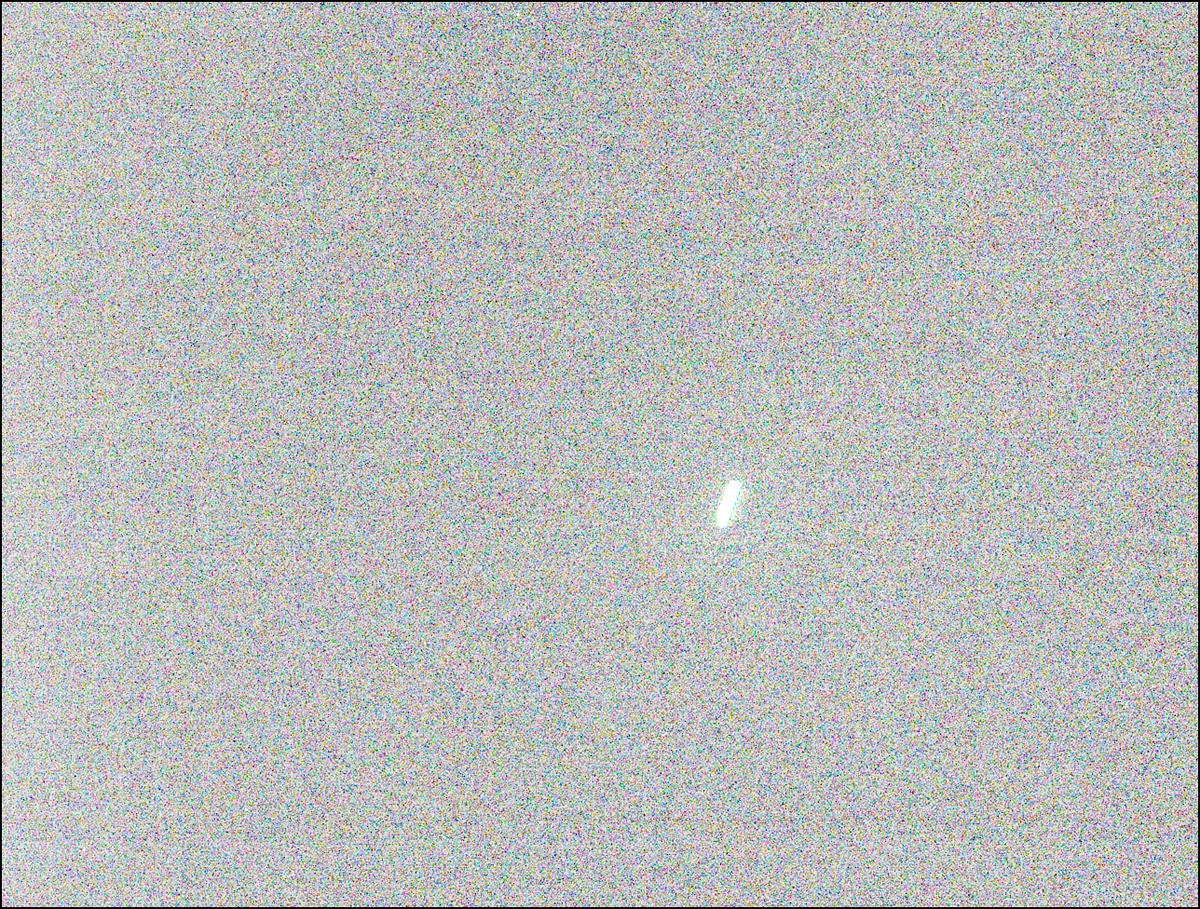 a grainy image showing a bright blurry shape
