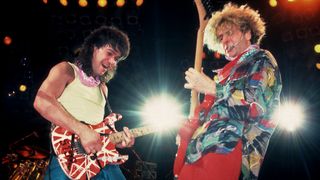 Rock musicians Sammy Hagar and Eddie Van Halen (1955 - 2020), both of the group Van Halen, perform onstage at the Metro Center, Rockford, Illinois, March 16, 1986. 