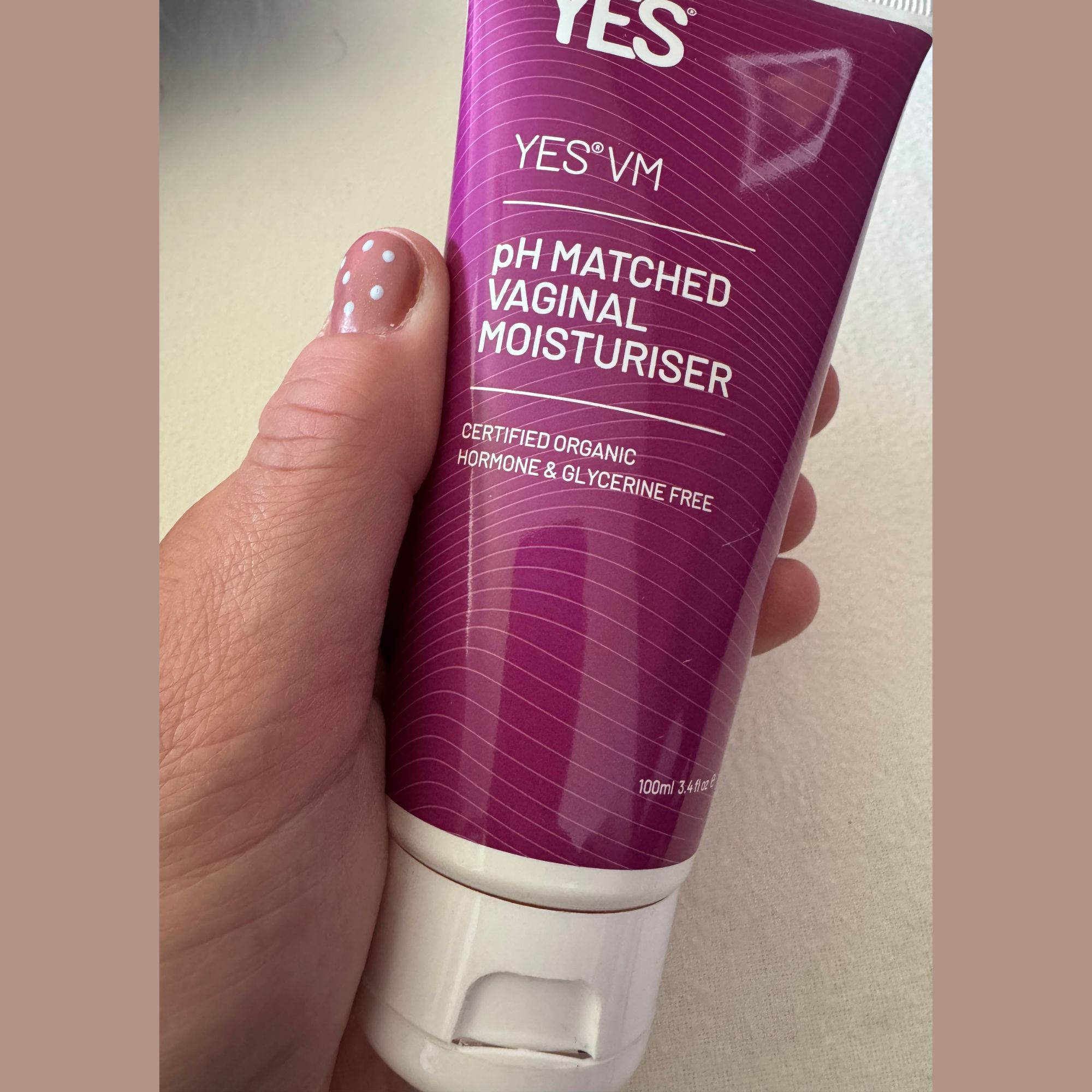 A tube of YES VM pictured in writer Heidi Scrimgeour's handwith her bathroom visible in the background