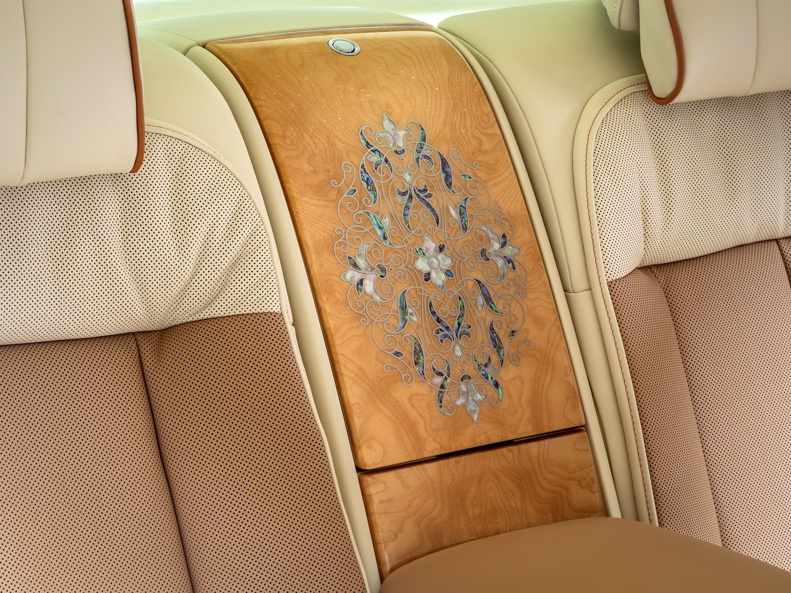 The floral motif on the rear waterfall section, inlaid into the Ash Burr veneer