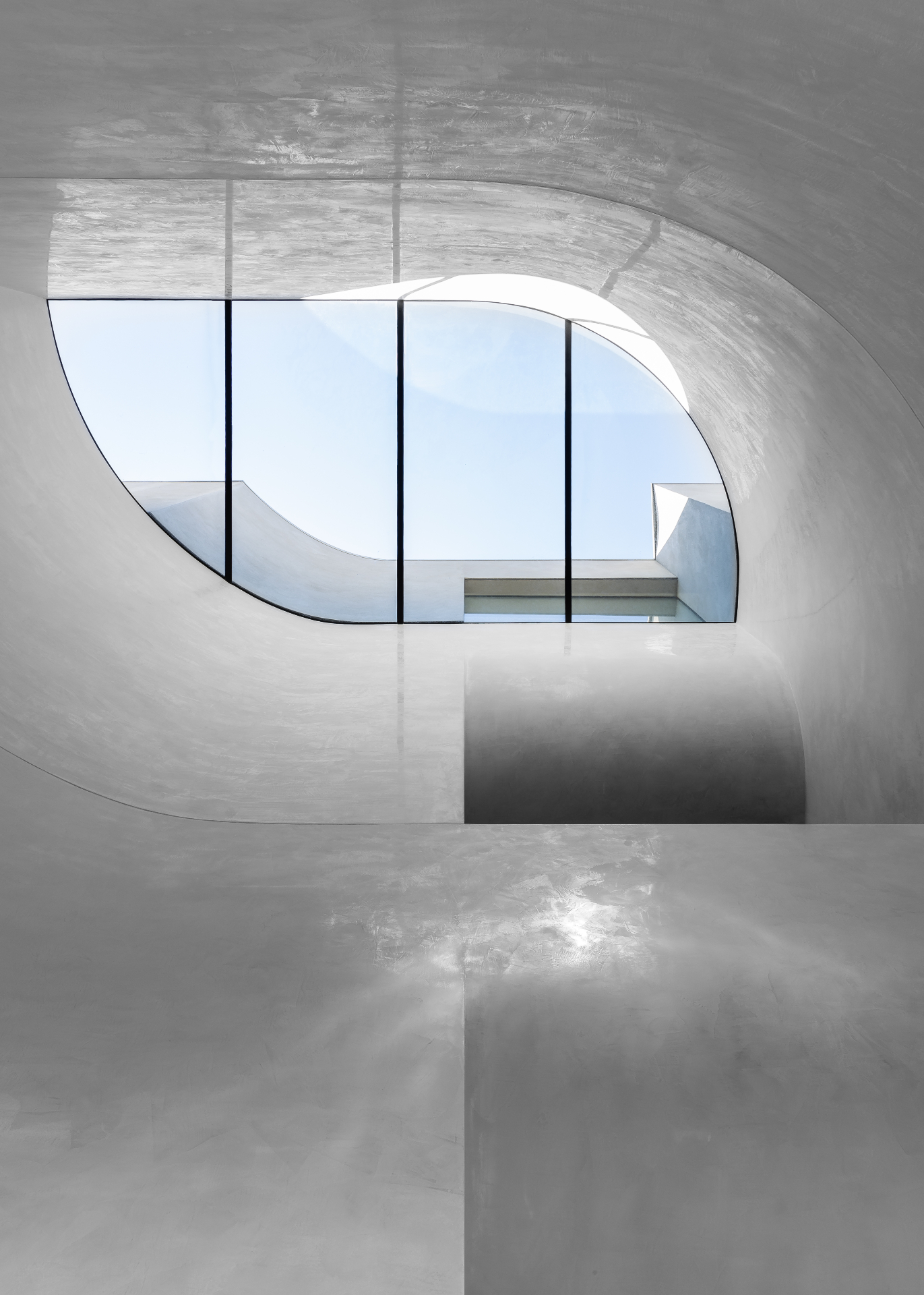 curvy window and white walls