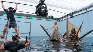 Behind the scenes on The Rings of Power with Galadriel (Morfydd Clark) and Halbrand (Charlie Vickers) filming the the raft scene from episode 2.
