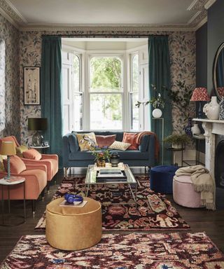 Cozy living room ideas from John Lewis featuring a colorful patterned scheme with pink and blue velvet seating, wallpaper and rugs.