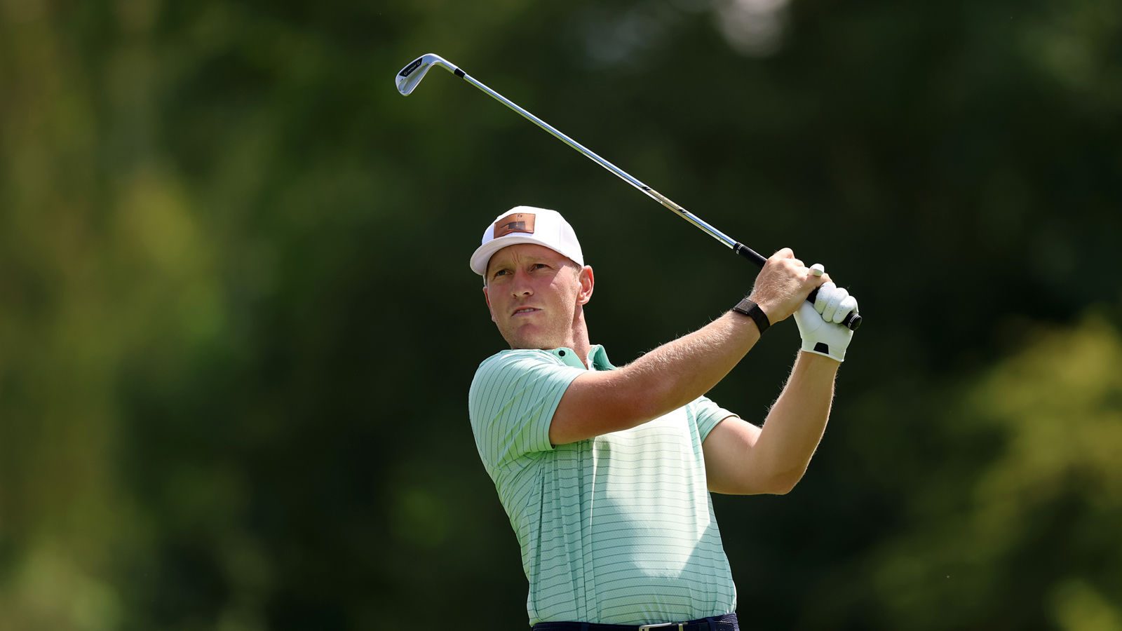 Brad Dalke hits an iron shot
