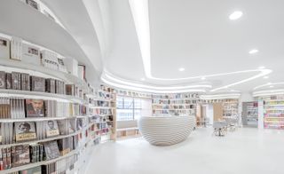 Elliptical bookshelves at Zhongshu Bookstore, by Wutopia Lab, Xi'an