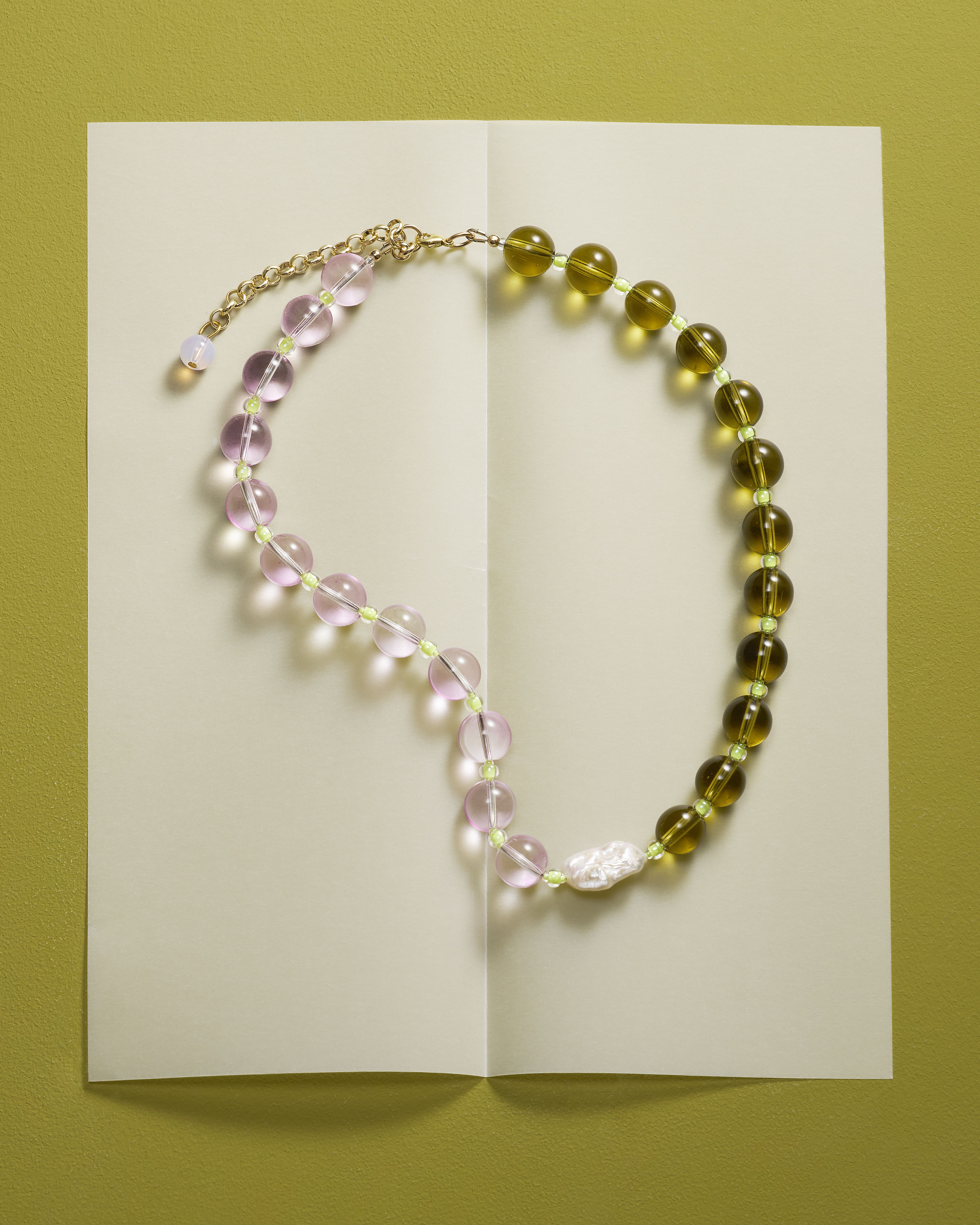 A series of product shots of colorful jewelry, design objects, and fashion accessories, as well as artist portraits of artisans in their busy studios.