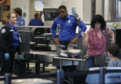 TSA agents at work