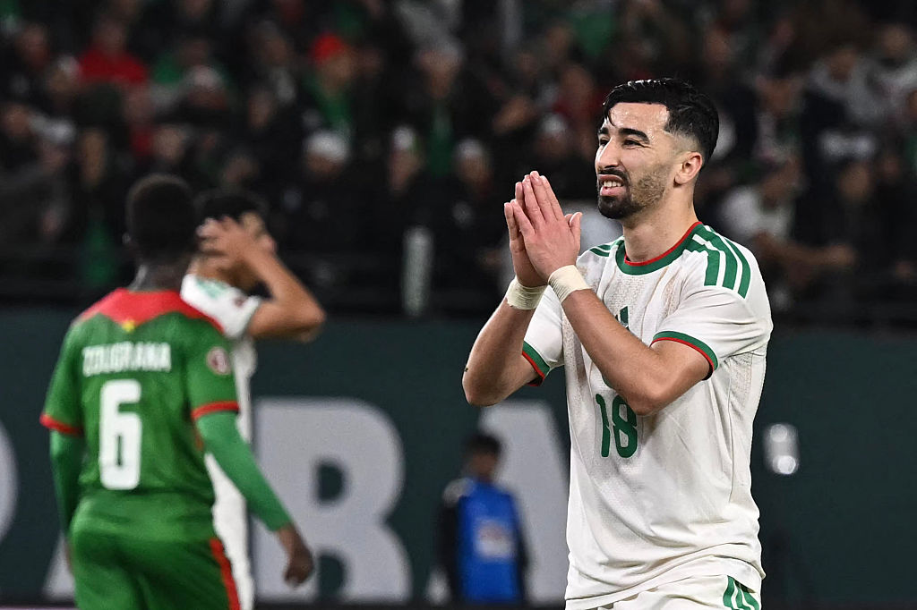 Algeria's forward #18 Mohamed Amoura (R) gestures during the Africa Cup of Nations (CAN) Group E football match between Algeria and Burkino Faso at Moulay Hassan Stadium in Rabat on December 28, 2025.