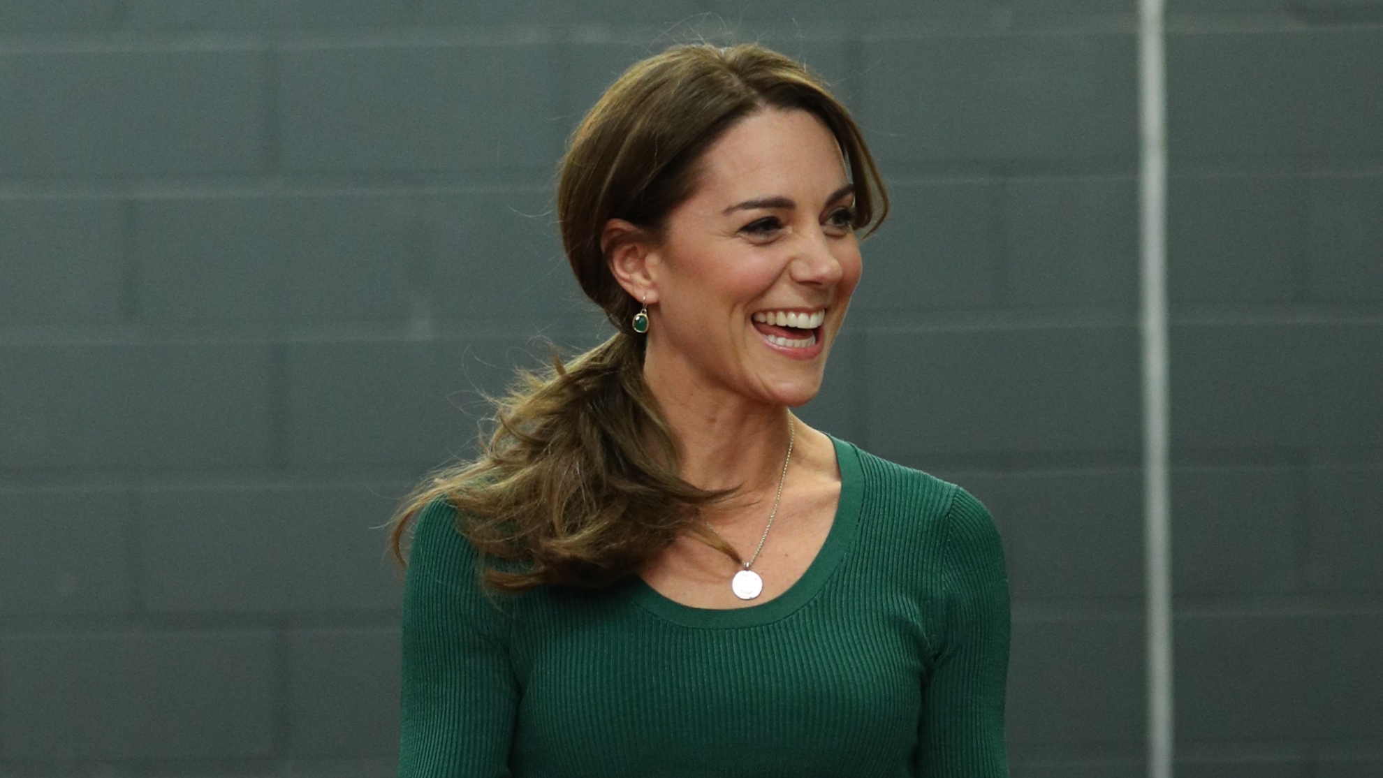 Catherine, Princess of Wales laughs after taking part in a short sprint race during a SportsAid Stars event at the London Stadium in Stratford on February 26, 2020