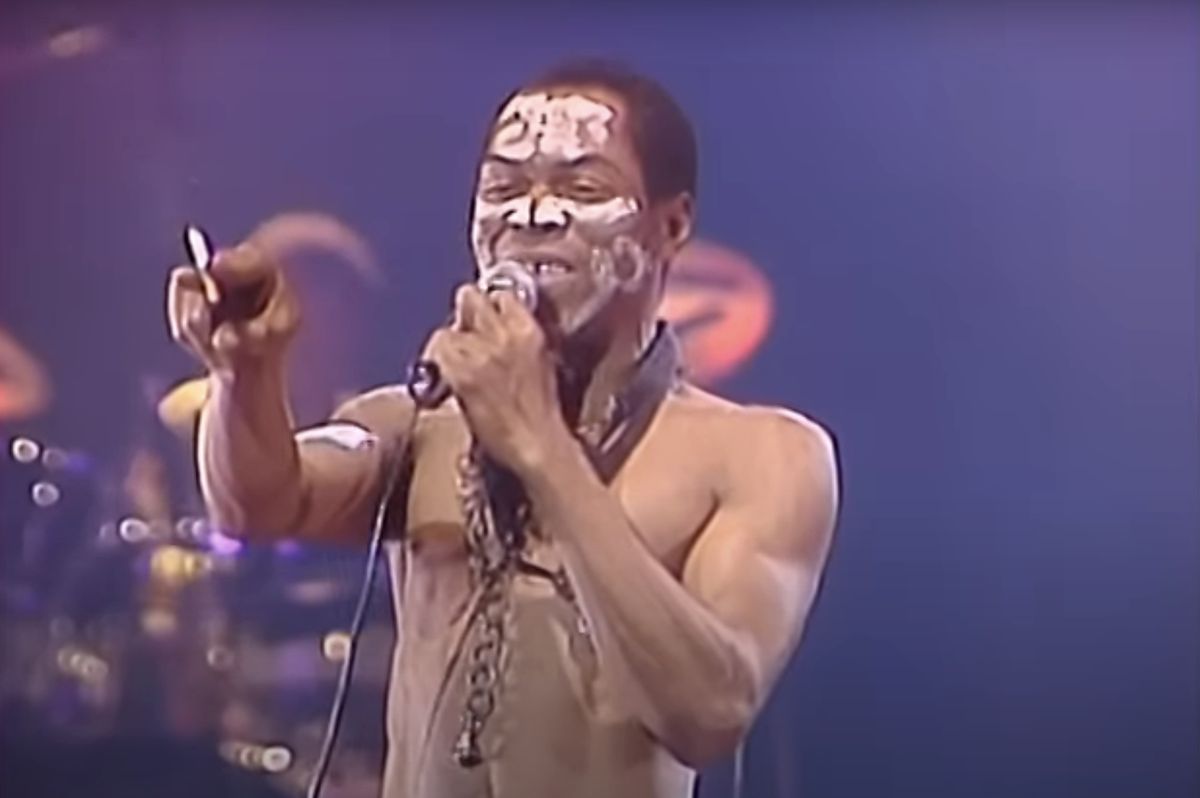 Fela Anikulapo Kuti points at the crowd during a concert.