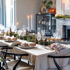 Decorated dining table for Christmas in neutral room